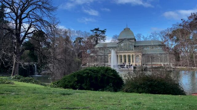 Madrid, Spain - February 23, 2023, Timelapse of Palacio de Cristal , Glass Palace, in Buen Retiro Park in Madrid, Spain. High quality video