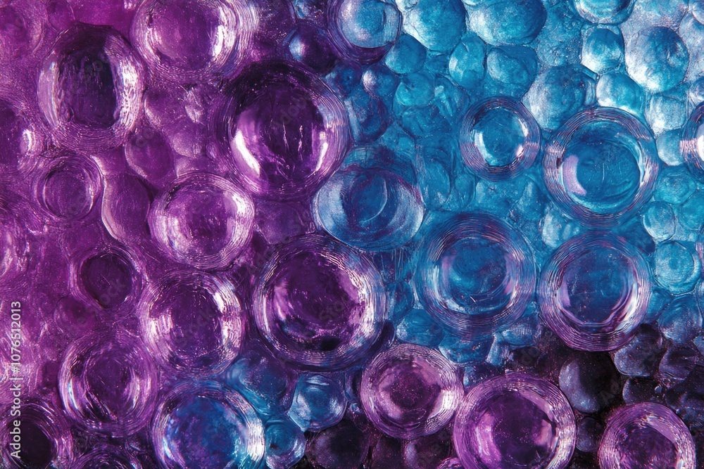 Poster a cluster of colorful bubbles in shades of purple and blue, ideal for use in illustrations, graphics