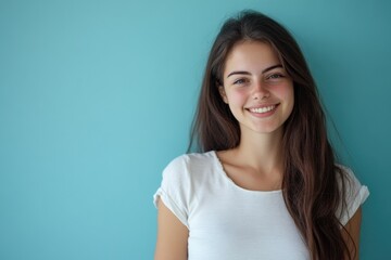 Fototapeta premium A portrait of a happy woman with long brown hair and a warm smile