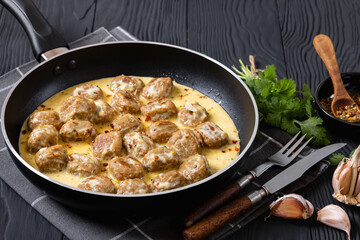 Ground poultry meatballs in a white cream gravy