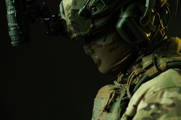 Side Profile of Soldier in Tactical Gear with Night Vision Goggles