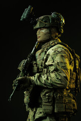 Profile of Soldier in Tactical Gear with Night Vision and Rifle