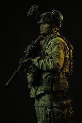 Profile of Soldier in Tactical Gear with Night Vision and Rifle