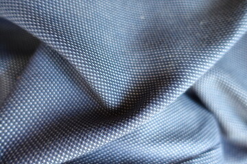 Crumpled striped cotton fabric in shades of blue