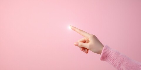 A hand gently touching a glowing point on a soft pink background.