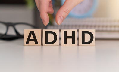 ADHD Abbreviation on ADHD cubes on a light background. Close ADHD - Attention Deficit Hyperactivity Disorder.