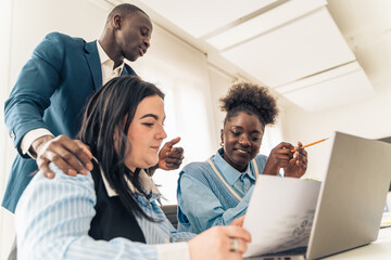 Professional business team discussing project strategy senior executive manager leading diverse group meeting in modern office