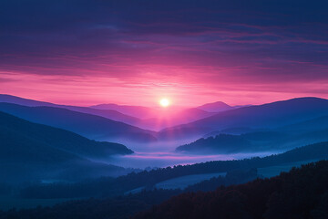 Obraz premium Sunrise over misty mountains in the early morning light