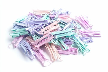 Pastel-colored plastic clothes pins on white.