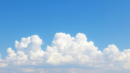 A tranquil blue sky with big puffy white clouds dominating the horizon, happy moment, calmness, white clouds