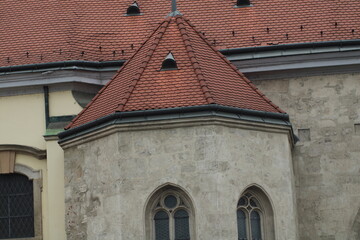 A historic building with distinctive architecture and a unique roof design in a European city...