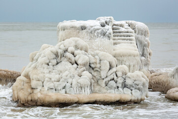 Icy constructions in the sea in winter