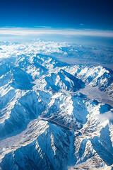Fototapeta premium A view of a mountain range from an airplane window