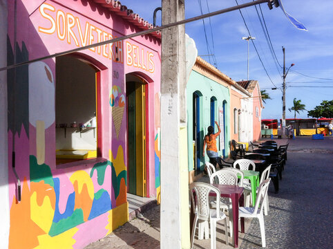 PORTO SEGURO, BAHIA STATE, BRAZIL - DECEMBER 04, 2012: colorful historic houses and tourist shops in busy bar street called "Passarela do Alcool"