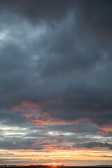 Beautiful skyscape with clouds at sunrise