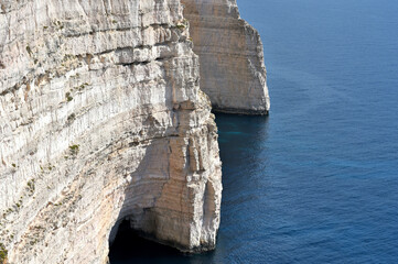 Views of rocky coast on a sunny day with blue sky. Gozo island