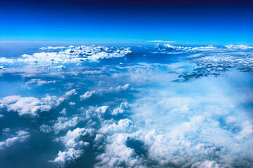Aerial view from airplane window above green ground. View from the airplane window with beautiful...