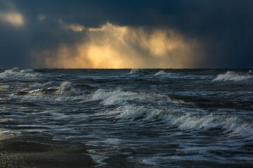 Wonderfully beautiful sunset by the sea in winter with ice