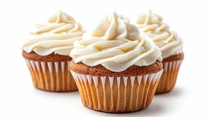 Three Vanilla Frosted Cupcakes on a White Background