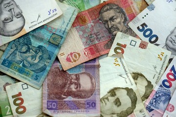 Big amount of different ukrainian hryvnia currency money bills in pile