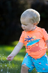 child playing with water