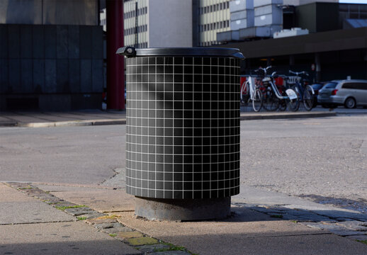 Trash Bin in an Urban Setting Near Bicycles and Parked Cars in Copenhagen. Customizable mockup.