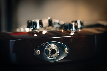 Electric guitar bridge, strings and pickup detail close-up
