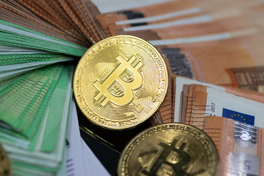 Golden Bitcoin coins, arranged alongside a pile of Euro notes, symbolizing the interplay between traditional and digital currency in modern finance