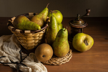 Top view of pears in basket on wooden table, horizontal, with copy space