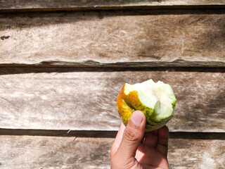 Hand holding a crystal guava fruit