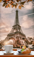 Coffee with croissants with symbol of Eiffel Tower in Paris, France