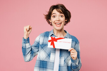 Young woman she wears blue shirt white t-shirt casual clothes hold gift certificate coupon voucher...