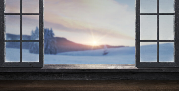 Fototapeta Window with panoramic view on a wintry landscape