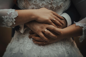 bride and groom holding hands
