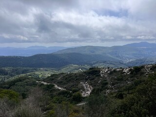 Fototapeta premium Monastery of Pantokrator in foggy mountains view near road. Corfu