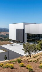 Obraz premium Explore the Harmonious Blend of Modern Architecture and Nature in a Stunning Hillside Facility Designed for Creative Synergy and Innovative Workspaces Enhancing Functionality and Aesthetics