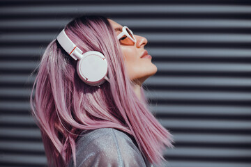 Young beauty girl purple hair make selfie on smartphone, happy face, outdoor hipster portrait on...