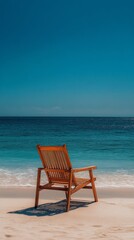 Wooden chair positioned on a quiet beach with turquoise waters on a sunny day