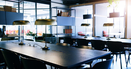 Empty office, meeting room and design of coworking space with table, chair or architecture at...
