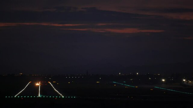 Aircraft taking off at night. Alicante airport, Spain