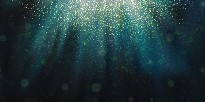 Magic christmas rays of light or underwater with glowing plankton, overlay effects and bokeh. Dark blue gradient background and photo fluorescent particles and microorganisms