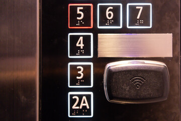 a wifi symbol on elevator panel. security system for hotel elevator.