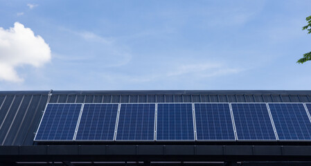 Naklejka premium A solar panel array is installed on a roof