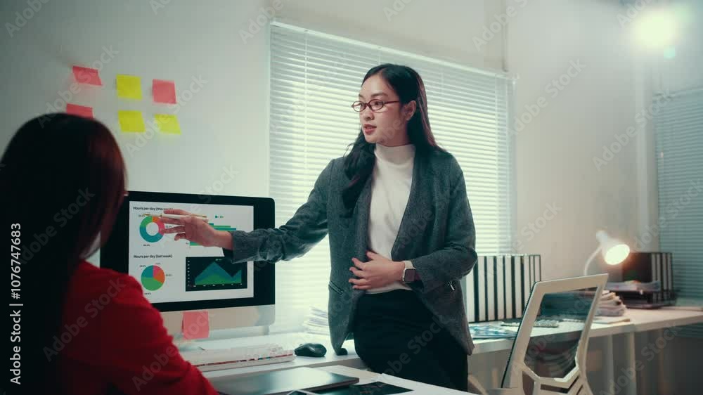 Poster business meeting of two asian businesswomen brainstorming and discussing data using computer and dig