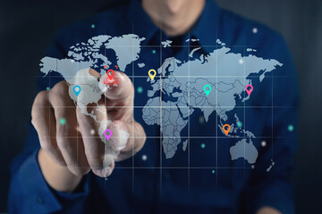 Man touching a virtual screen of world map infographic. World map infographic with color pointers.