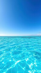 Obraz premium Crystal clear turquoise Caribbean water glistening under a flawless blue sky, summer, sunny