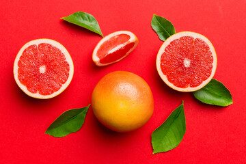 fresh Fruit grapefruit with Juicy grapefruit slices on colored background. Top view. Copy Space....