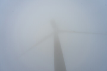 Wind generator in foggy morning in Parque Eolico - El Cabrito in Tarifa, Spain