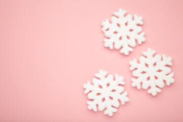 Beautiful snowflakes on pink background. Space for text