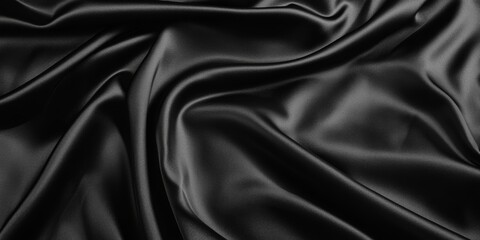Fototapeta premium Luxurious black satin fabric with rich folds, creating a soft and flowing texture. Elegant and vibrant material ideal for backgrounds, banners, or fashion-themed projects.